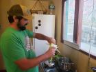 Josh removing the husk from the corn 