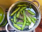 The corn and lima beans are being boiled with anise and sugar