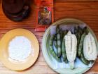 The lima beans and corn are finished boiling