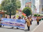 Indigenous men march to support Evo Morales