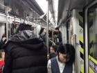 A very crowded metro car