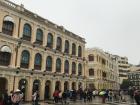 The buildings and cobblestone streets in Macao reflect the architecture styles of Portugual
