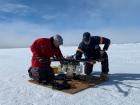 A team working together to launch a drone