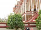 A motor bike sitting outside a temple