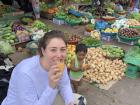 Me eating a nom paong with a little boy in the market