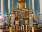 Inside of the pagoda, people worship a statue of Buddha