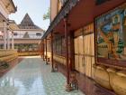 The paintings along the walls tell Buddhist stories