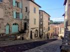 Dark red volcanic rock is used to pave the roads and build houses