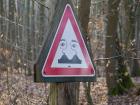Someone drew a funny face on a road sign...
