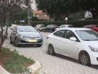 Parked cars are often found on the sidewalk here