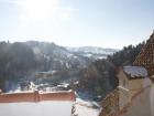 A snowy view from the top of Bran's Castle