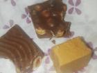 Pictured are two different types of turrón. One has milk chocolate and nuts and the other tastes like a moist Graham cracker.
