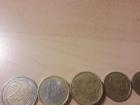 Pictured are euro coins for 2 euros, 1 euro, 50 cents, and 20 cents