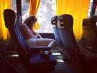 A friend takes a nap on a charter bus to Montenegro