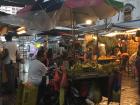 Tents keep the market stands dry during the rain