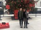 My host mother and me in front of a Christmas tree at a mall that used to be a hospital