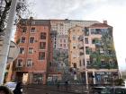 Walking around the city, you see massive murals painted on the side of buildings 