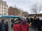 People filling the streets of a shopping center 