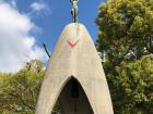 A statue of Sadako Sasaki holding a paper crane