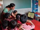 Students using speech therapy games my team developed at a school for the deaf in India