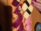 Sushi is rice balls with fish or other toppings on top; the bottom-left is whale sushi
