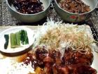 Food from the Nagano region of Japan... the bowl on the left has grasshoppers, and the one on the right contains bee larvae