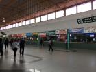 The inside of the bus terminal where you can see all of the ticket booths