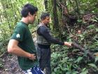 Our tour guide showing me a type of tree bark that people can burn as incense