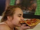 Enjoying a slice of pizza the size of my head after a night out