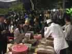 A chef making peanut ice cream rolls during a festival