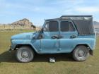 A parked Mongolian car along the highway