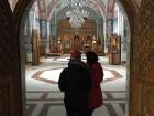 Kelly and her best friend standing at the entrance to the new chapel of  Brâncoveanu Monastery