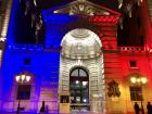The Justice Palace in Paris illuminated with the French flag's colors