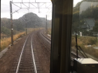 A view out the front of a moving train a little outside of Tokyo