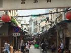 Many streets in Chinese cities have large stone arches like this one