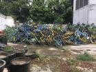 A grave yard of bicycles in a back alley Guangzhou