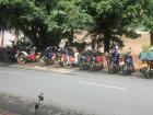 A typical street view in Luang Prabang - a row of motorbikes