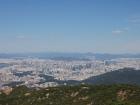 Can you see the mountainous terrain surrounding Seoul?