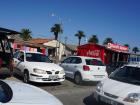 A group of cars parked on the street