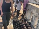 My roommate Eva is checking out the extremely heavy cannonballs that are stacked as a remnant of a violent period of Ghanaian history