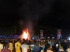 Members of the Ashanti tribe proudly gather at a school bonfire event to sing and dance in their traditional styles