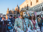 Two very dressed-up carnivale attendees in Venice, near St. Mark's Basillica