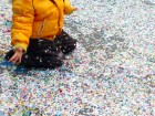 Children throw confetti all over the streets during carnivale