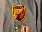 Patches on my host sister's Scouts uniform. Lazio is the region Rome is in and the "Roma" patch identifies her as a Scouts member of Rome.