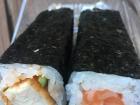 The left is a roll with chicken and the right is a salmon avocado roll