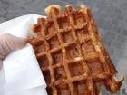 A Liege Waffle served on the street, no untensils needed