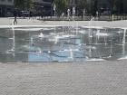This in ground fountain is located in the town plaza and has a depiction of the Globe on it