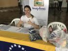 Distributing aid and recording data at a humanitarian aid event in Simon Bolivar