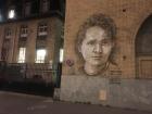 Marie Curie's laboratory, with a street art portrait on the wall