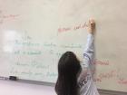 Practicing writing Romanian on the board